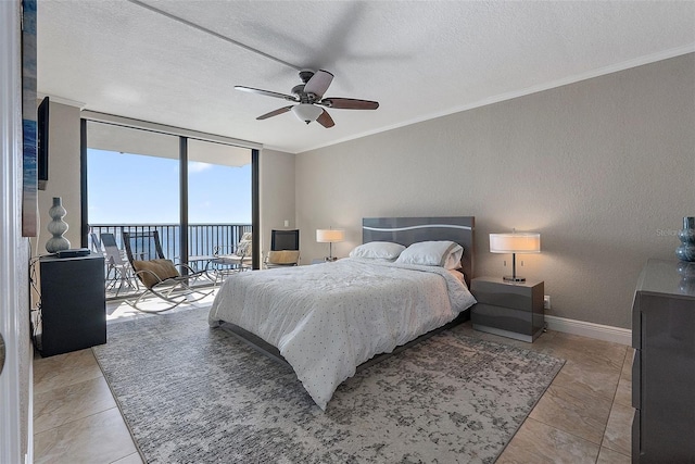 bedroom with crown molding, a textured ceiling, access to exterior, and a wall of windows