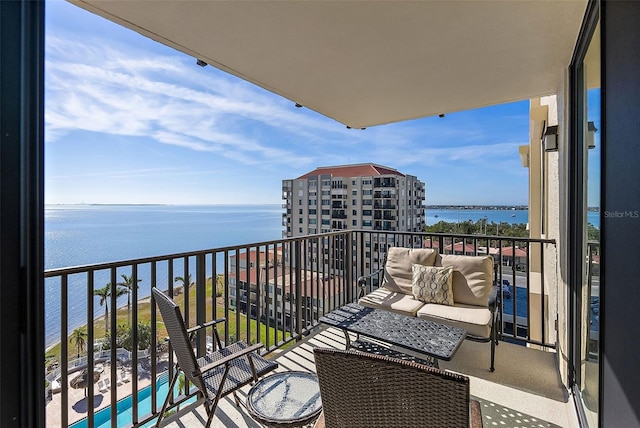 balcony featuring a water view