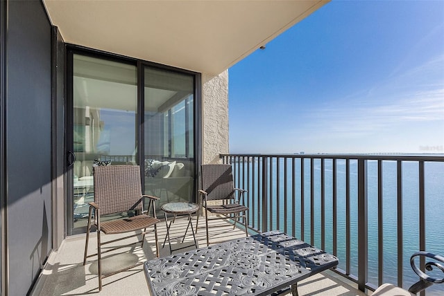 balcony featuring a water view