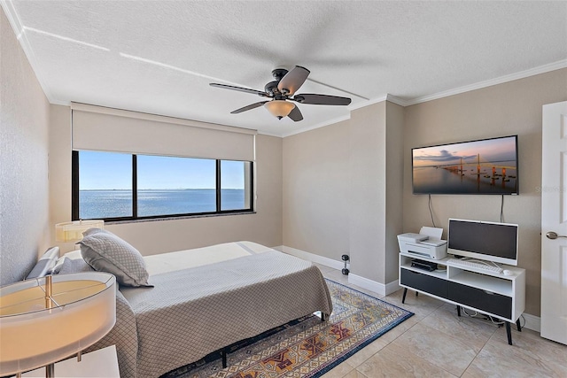 bedroom featuring ornamental molding, ceiling fan, and a textured ceiling