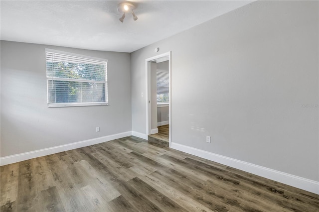 unfurnished room featuring hardwood / wood-style floors