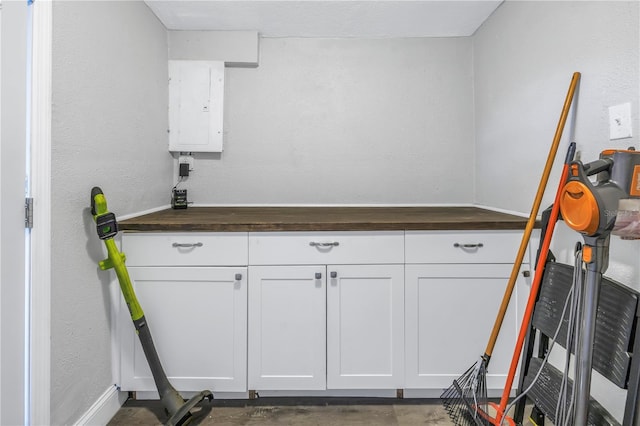 clothes washing area featuring electric panel