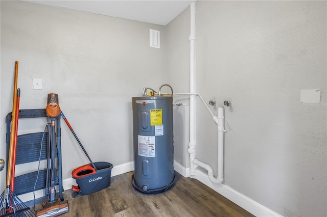 utility room featuring electric water heater