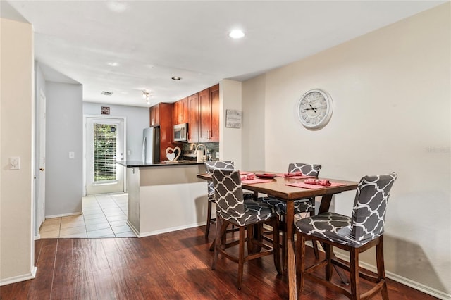 dining room with light hardwood / wood-style flooring