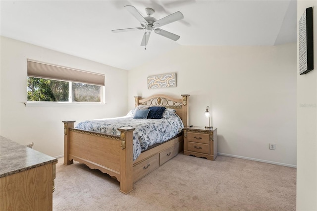 bedroom with vaulted ceiling, light colored carpet, and ceiling fan