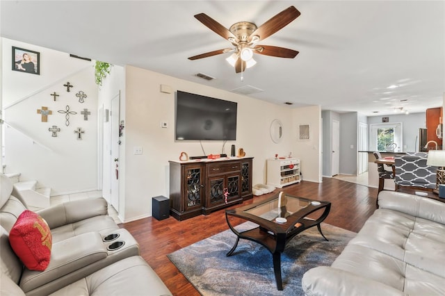 living room with hardwood / wood-style floors and ceiling fan