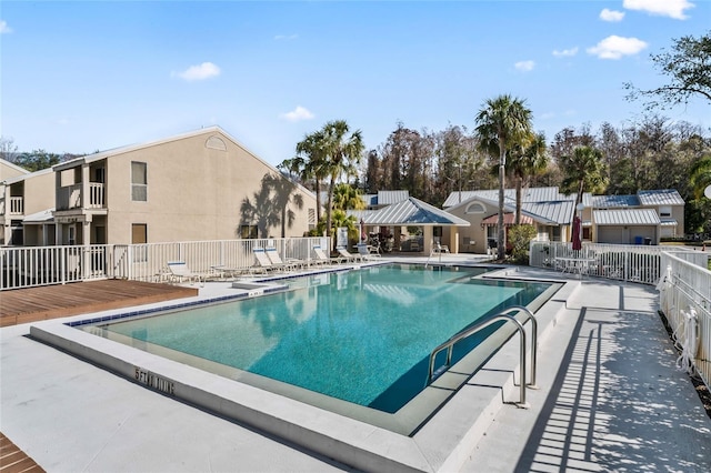 view of swimming pool with a patio