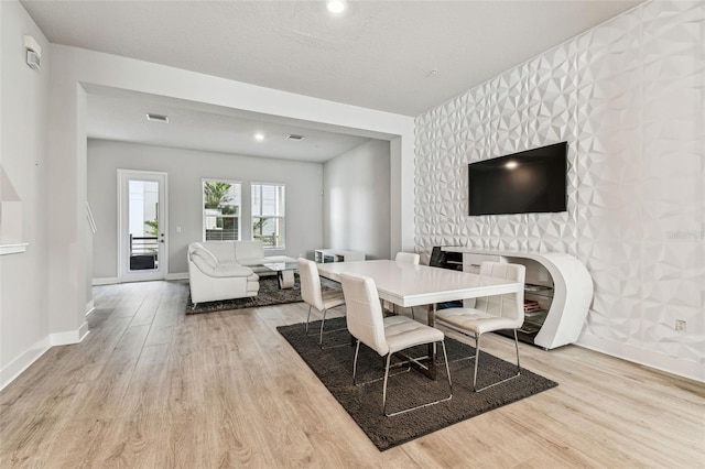 dining space featuring light hardwood / wood-style flooring