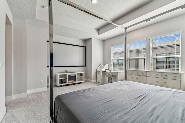 carpeted bedroom featuring a textured ceiling