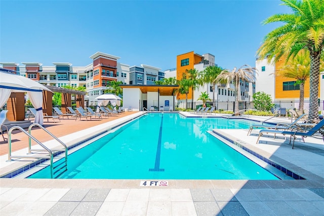 view of swimming pool featuring a patio area