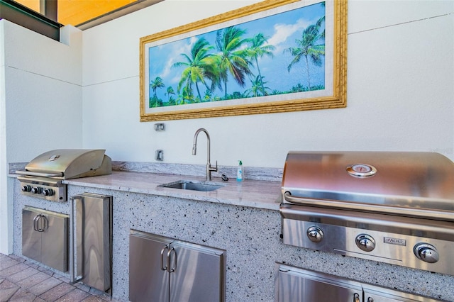 view of patio / terrace featuring area for grilling, sink, and grilling area