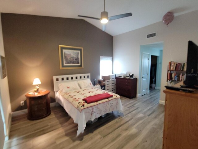 bedroom with wood-type flooring, lofted ceiling, and ceiling fan