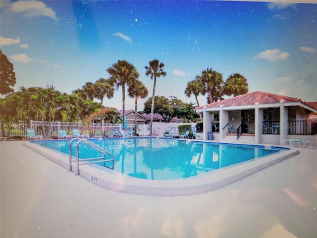 view of swimming pool with a patio area