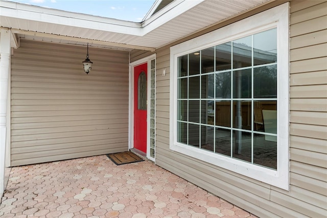 entrance to property featuring a patio area