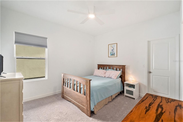 bedroom with light colored carpet and ceiling fan