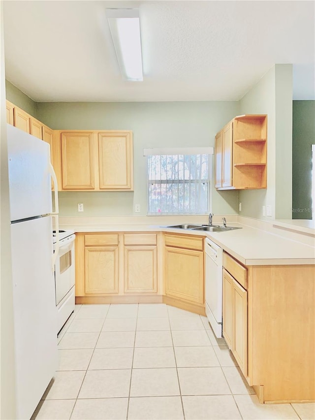 kitchen with sink, light brown cabinets, white appliances, and light tile patterned floors