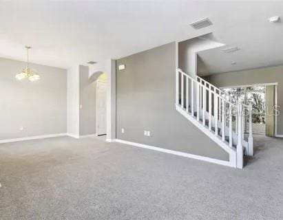 unfurnished living room with carpet