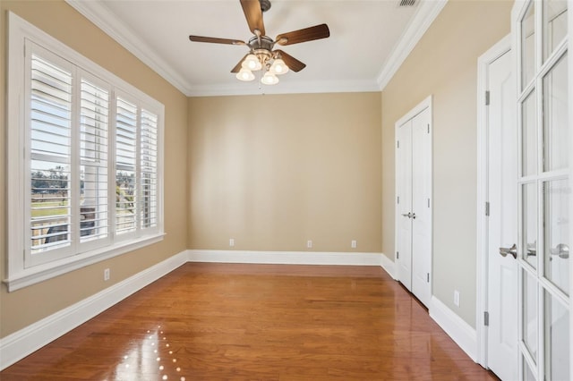 unfurnished room with crown molding, ceiling fan, and hardwood / wood-style floors