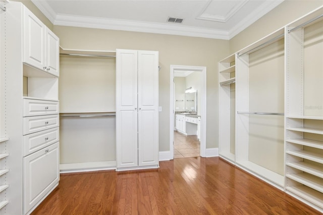 spacious closet featuring hardwood / wood-style flooring