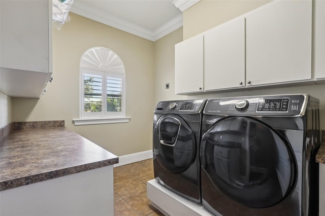 washroom featuring light tile patterned flooring, cabinets, ornamental molding, and separate washer and dryer