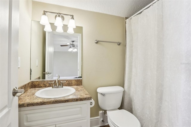 bathroom with vanity, ceiling fan, and toilet