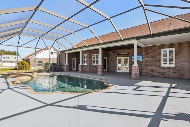 view of pool featuring french doors, a patio area, a lanai, an in ground hot tub, and ceiling fan