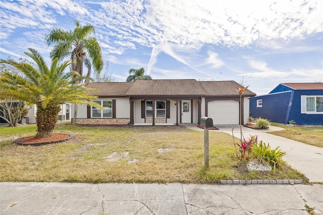 single story home with a garage and a front yard