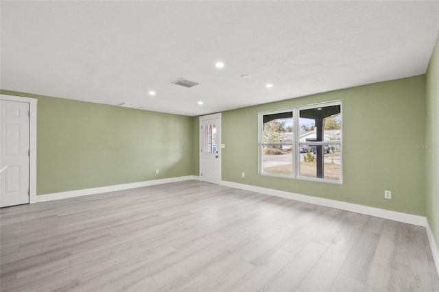 unfurnished room featuring light hardwood / wood-style floors