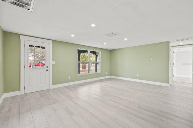 interior space with a healthy amount of sunlight and light wood-type flooring