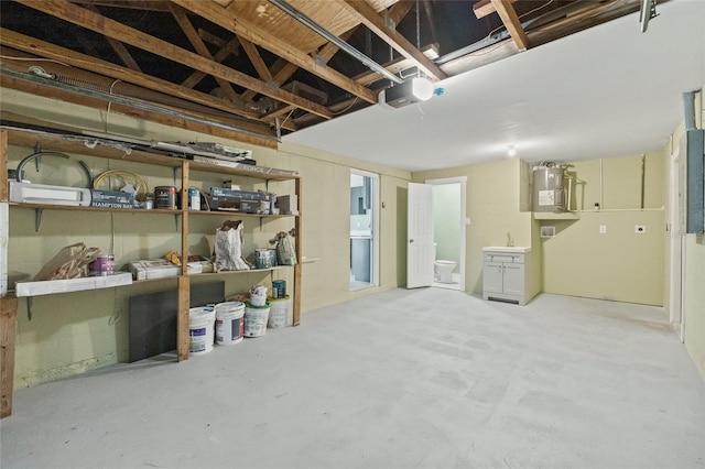 basement featuring sink and electric water heater