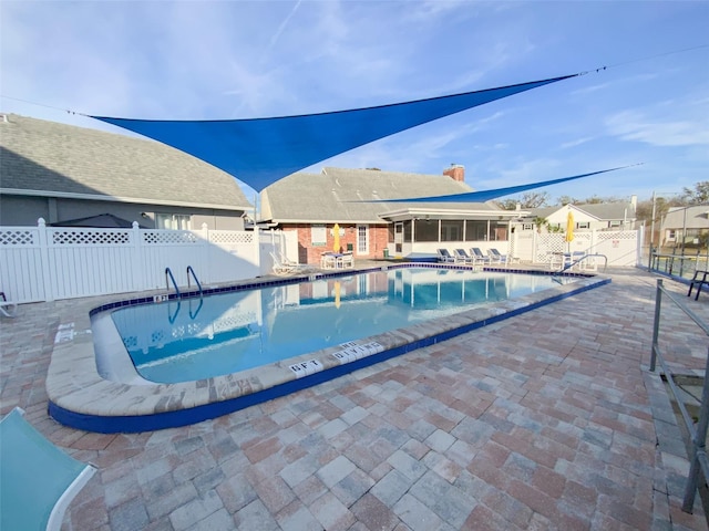 view of swimming pool with a patio