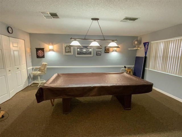 game room with billiards, a textured ceiling, and carpet