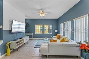 tiled living room featuring ceiling fan