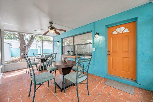 sunroom / solarium with ceiling fan