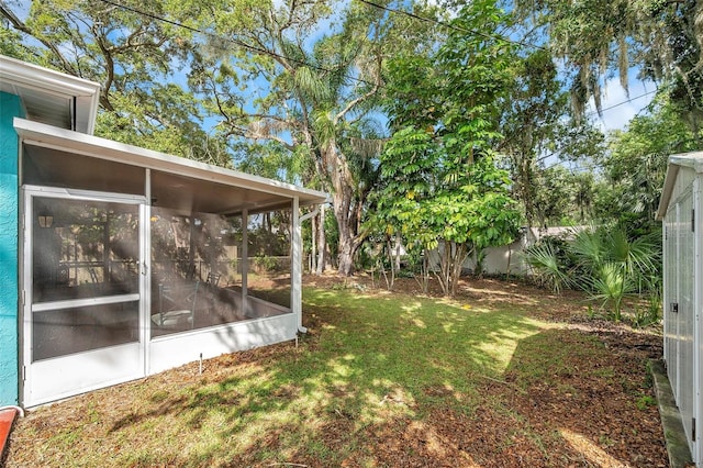 view of yard featuring a sunroom