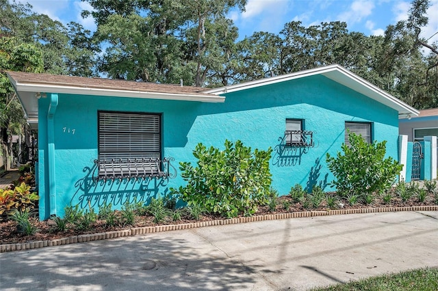 view of side of property with a patio