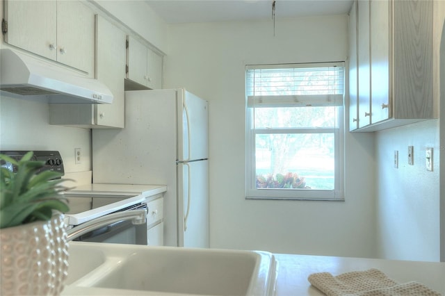 kitchen with white range with electric cooktop