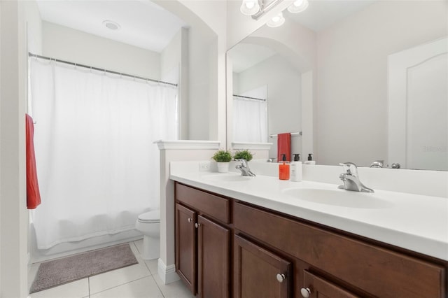 full bathroom with shower / bath combination with curtain, vanity, tile patterned floors, and toilet