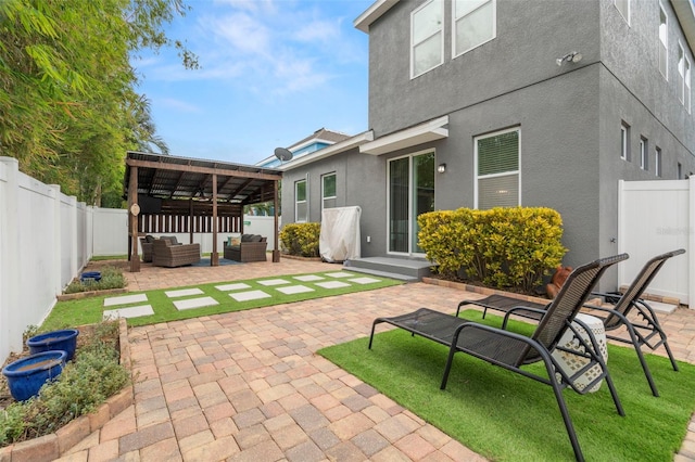 rear view of property featuring an outdoor living space, a pergola, and a patio