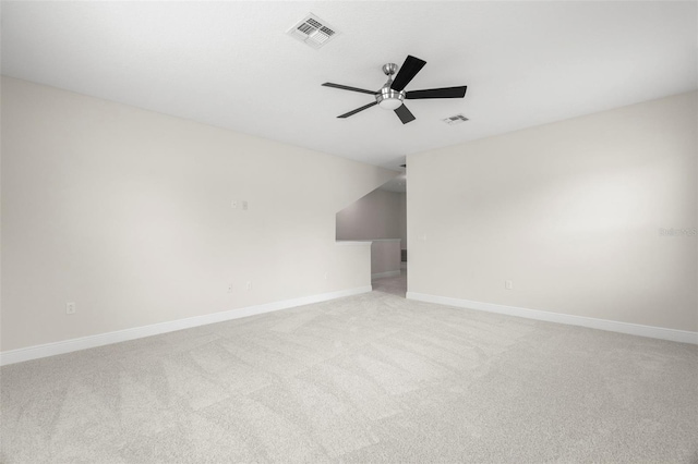 unfurnished room featuring light colored carpet and ceiling fan