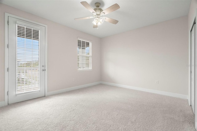 unfurnished room with carpet floors and ceiling fan