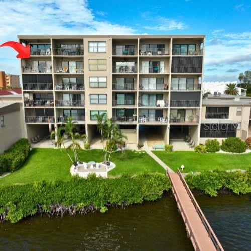 view of building exterior with a water view