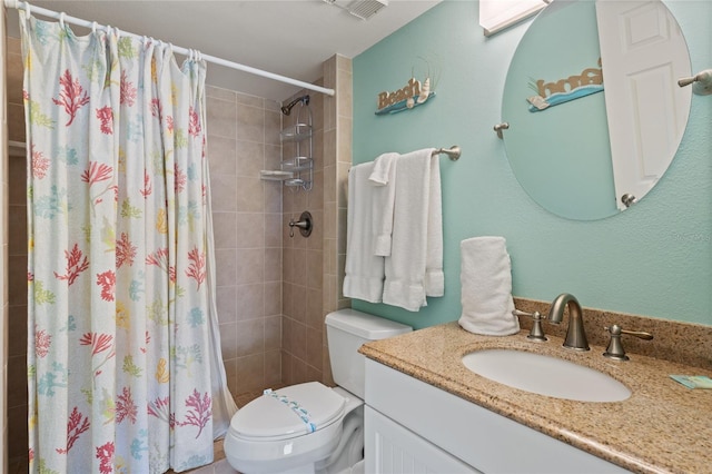 bathroom with vanity, toilet, and walk in shower