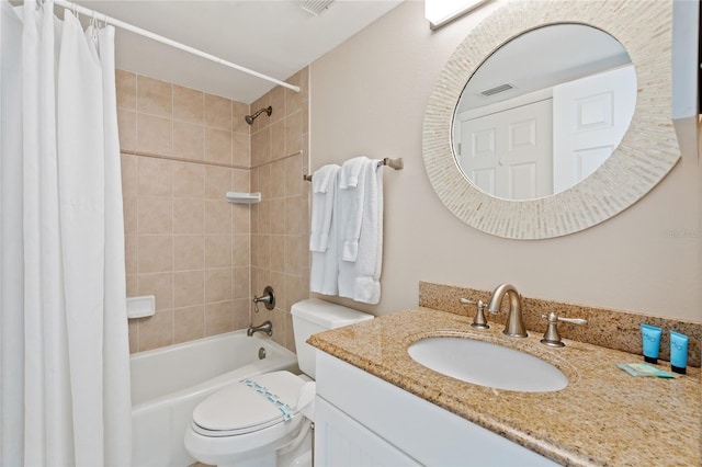 full bathroom with shower / bath combo, vanity, and toilet