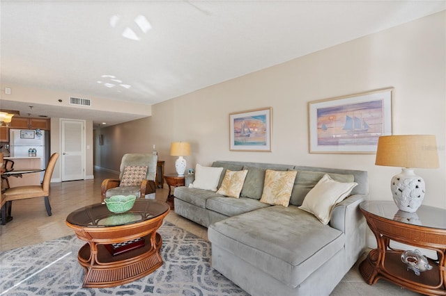 living room with light tile patterned flooring