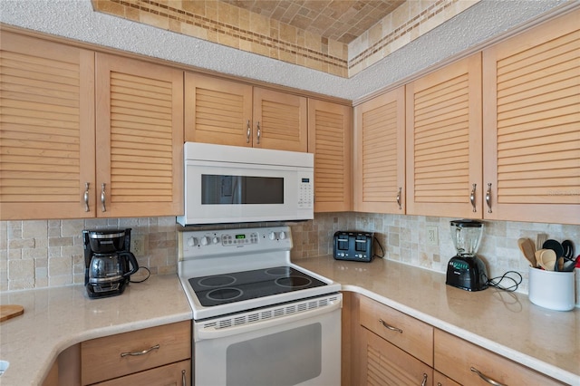 kitchen with white appliances, decorative backsplash, and light brown cabinets