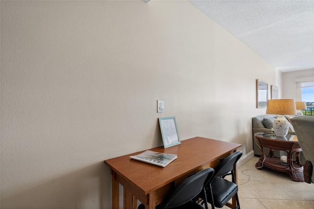 office space with light tile patterned floors and a textured ceiling