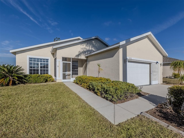 single story home featuring a garage and a front yard