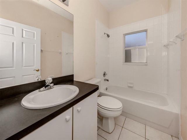 full bathroom featuring tiled shower / bath combo, vanity, tile patterned floors, and toilet