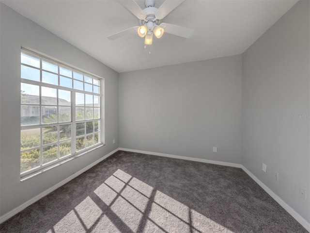 24156 Buckingham Way, Punta Gorda, FL 33980 - empty room with dark colored carpet, baseboards, and a ceiling fan
